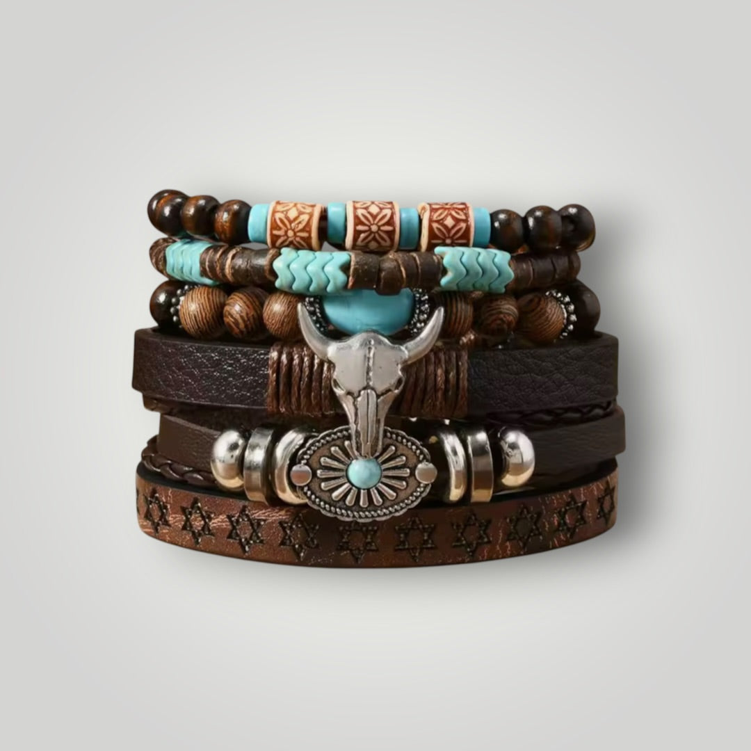 A stack of western-style leather and bead bracelets with brown wood beads, turquoise accents, silver-toned metal details, and a central skull charm, photographed on a light gray background.