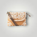 A small crossbody clutch bag with a brown woven patterned body, a brown leather strap, and a gold-tone buckle, shown on a light gray background.