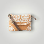 A small crossbody clutch bag with a brown woven patterned body, a brown leather strap, and a gold-tone buckle, shown on a light gray background.