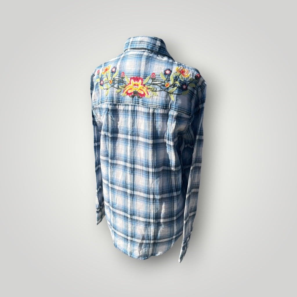 A blue and white plaid long-sleeve shirt shown from the back, featuring colorful floral embroidery across the upper back and shoulders.