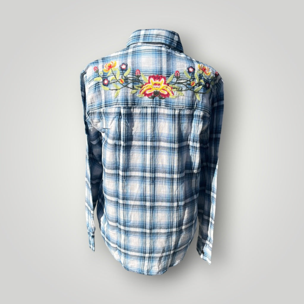 A blue and white plaid long-sleeve button-up shirt shown from the back, featuring a colorful embroidered floral design across the upper back.
