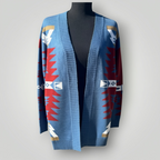 A blue open-front knit cardigan sweater with red, white, and gold geometric Southwestern-style patterns, displayed on a black mannequin torso against a light gray background.